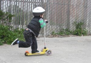 little-boy-on-a-3-wheel-scooter