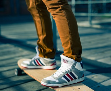 person in brown denim on his skateboard