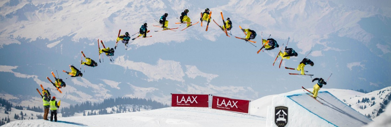 timelapse image of a snowboarder's big air jump