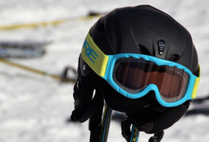 ski helmet resting on two skis