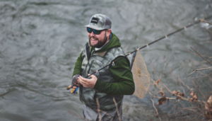 Man smiling while fishing