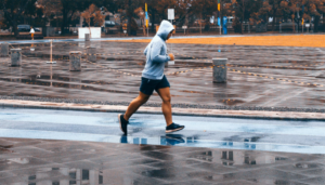 Man in hood running