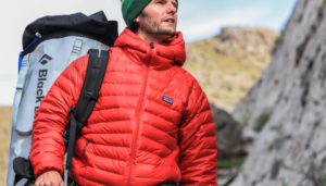 Man with hiking backpack looking up