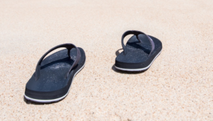 Sandal on a white sand