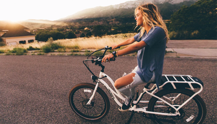 Woman riding in bicycle